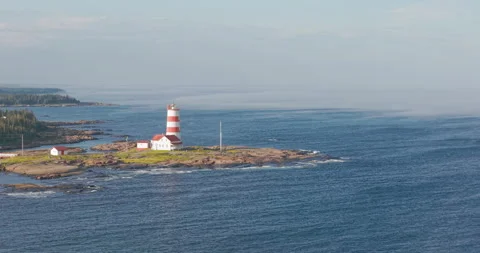 Pointe-des-Monts Lighthouse on the North Shore of Quebec – Aerial Drone View Stock Footage 315536173