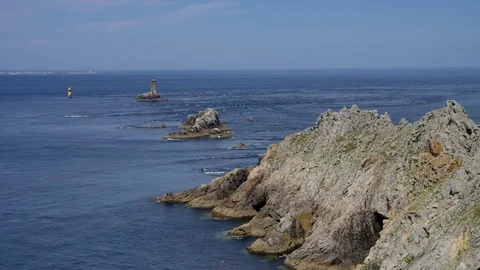 Pointe du Raz and lighthouse Phare de la Vieille in Brittany, France Stock Footage 82415843