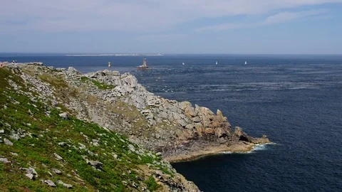 Pointe du Raz and lighthouse Phare de la Vieille in Brittany, France Stock Footage 83587809