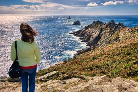 Pointe du Raz, Brittany, France. Woman looking at the sea. Stock Photos