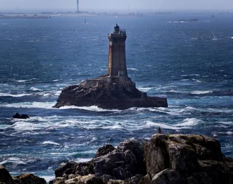 Pointe du Raz cliff in France and a headlight in the sea Stock Photos