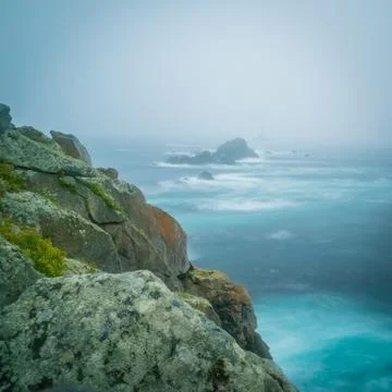 Pointe du raz with clouds and fog under a storm in France Stock Photos