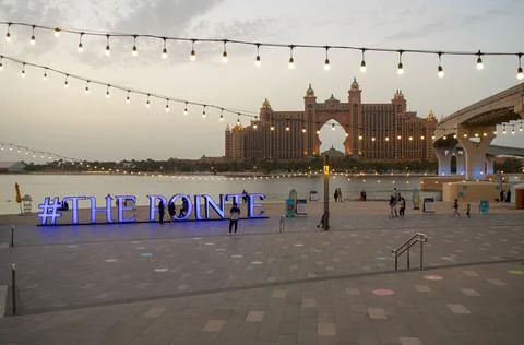 The Pointe sign in a square with the view on Atlantis, The Palm hotel before the Stock Photos