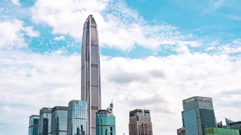 Pointed supertall tower beneath white cloud streaks - Shenzhen Stock Footage 346622304