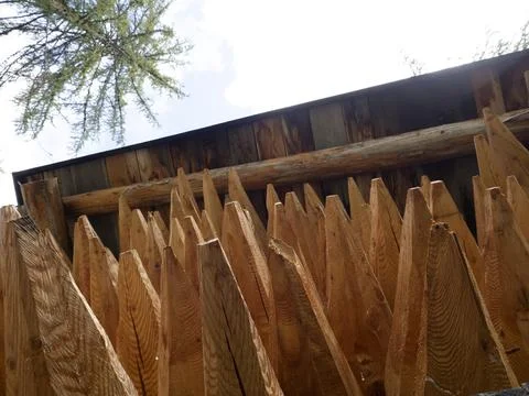 Pointed wood logs pattern inside hut Stock Photos