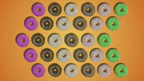 Pointer arrow made of donuts with colorful icing, sprinkles on orange background Stock Footage 194655247