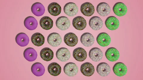 Pointer arrows made of donuts with sprinkles and icing on pink background Stock Footage 194658452