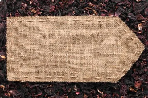 Pointer of burlap lying on a dry hibiscus background Stock Photos