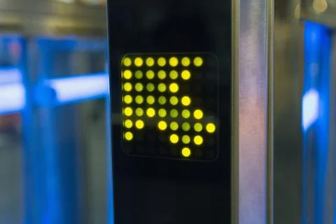Pointer direction in the form of luminous green arrows. Urban Stock Photos