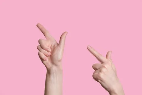 Pointer to the left. A beautiful caucasian hand indicates the direction. Stock Photos