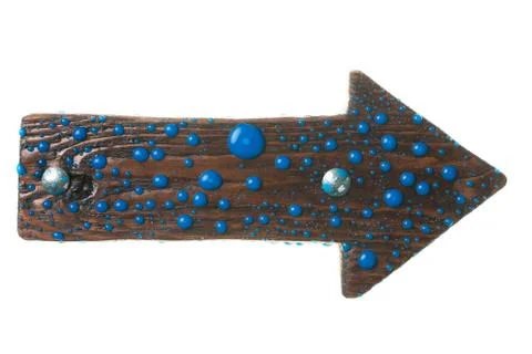Pointer made of dark wood with metal bolts and drops of paint. Isolated Foto stock