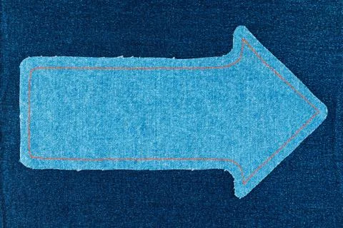 Pointer made of denim fabric with yellow stitching on denim Stock Photos