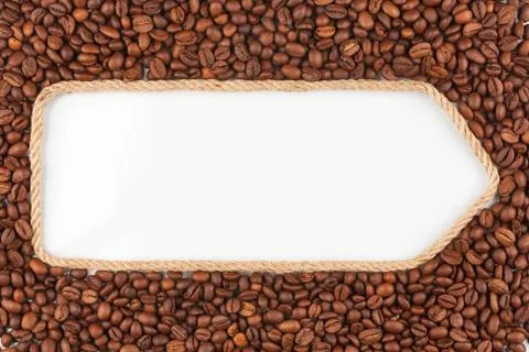 Pointer made from rope with coffee beans  lying on a white background Stock Photos