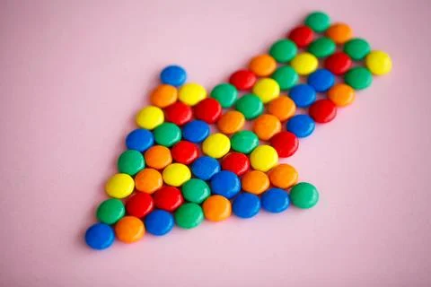 Pointer on the Pink Background. Colored Candy. Diet. Healthful N Stock Photos