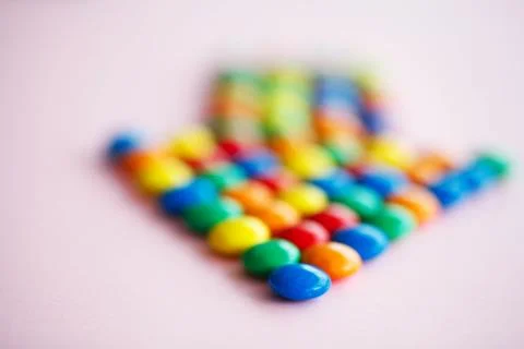 Pointer on the Pink Background. Colored Candy. Diet. Healthful N Stock Photos