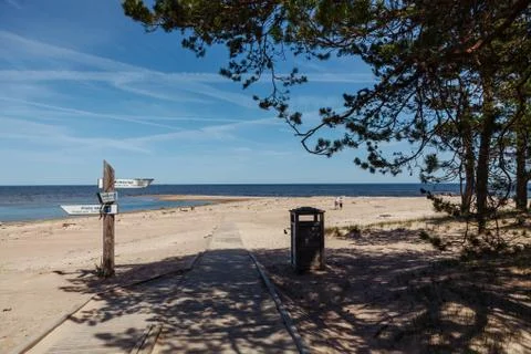 Pointers on the pillar on the beach. Cape Kolka. Latvia. Stock Photos