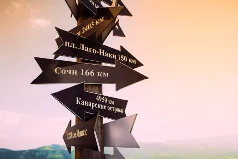 Pointers point to different directions. Russian text sochi minsk canary islan Foto stock