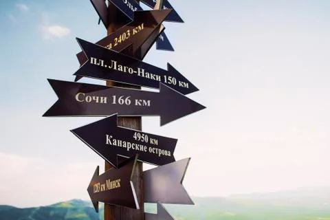 Pointers point to different directions. Russian text sochi minsk canary islan Stock Photos
