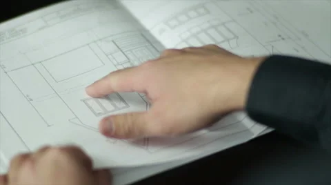 Pointing at Architectural Blueprints Stock Footage 40648535