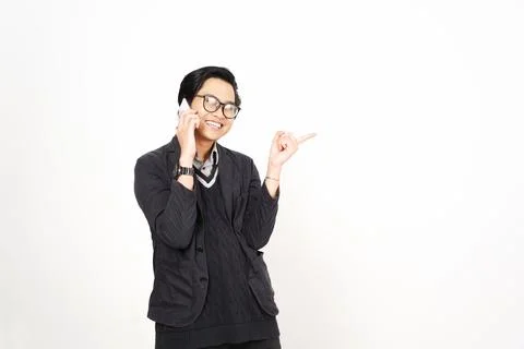 Pointing aside with forefinger while on phone Of Handsome Asian Man Isolate.. Stock Photos