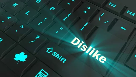 Pointing on blue glowing Dislike key Stock Footage 100635389