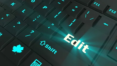 Pointing on blue glowing Edit key Stock Footage 100561650