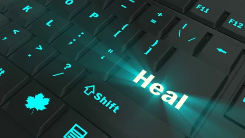 Pointing on blue glowing Heal key Stock Footage 100635925