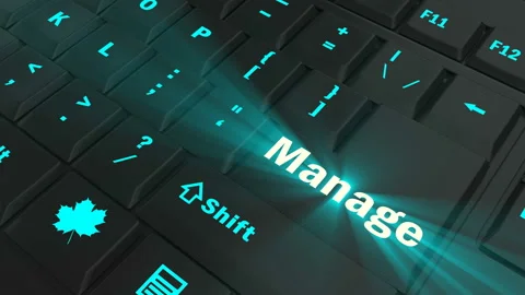Pointing on blue glowing Manage key Stock Footage 100582568