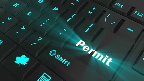 Pointing on blue glowing Permit key Stock Footage 100608466