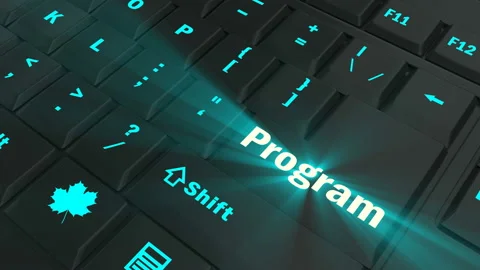 Pointing on blue glowing Program key Stock Footage 100608639