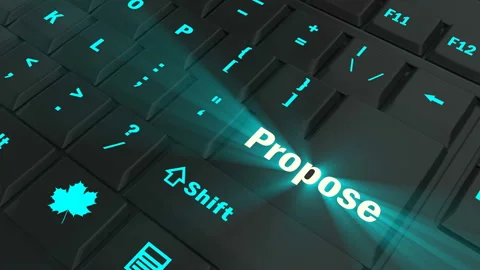 Pointing on blue glowing Propose key Stock Footage 100608708