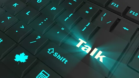 Pointing on blue glowing Talk key Stock Footage 100609204