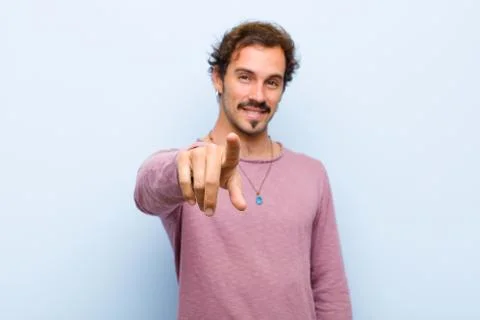 Pointing at camera with a satisfied, confident, friendly smile, choosing you Stock Photos