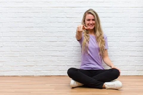 Pointing at camera with a satisfied, confident, friendly smile, choosing you Stock Photos