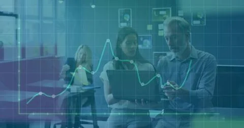 Pointing colleagues checking laptop data in office with overlay and documents, Stock Photos
