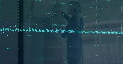 Pointing colleagues leaning forward interpreting data at office glass panel, Stock Photos