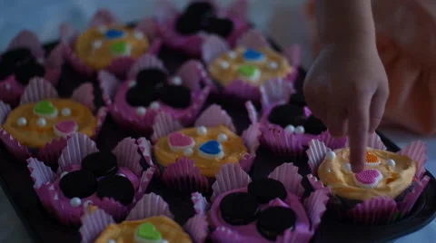 Pointing at Cupcakes Stock Footage 56601649