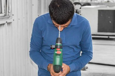 Pointing drill machine and trying to suicide by a drill Stock Photos