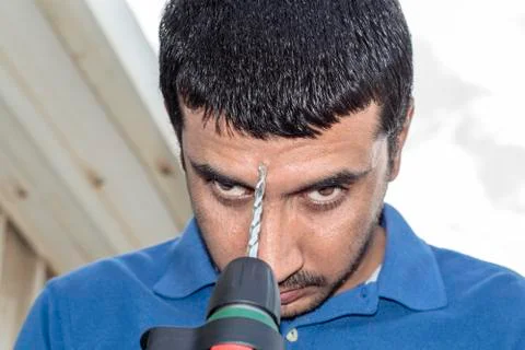 Pointing drill machine and trying to suicide by a drill Stock Photos