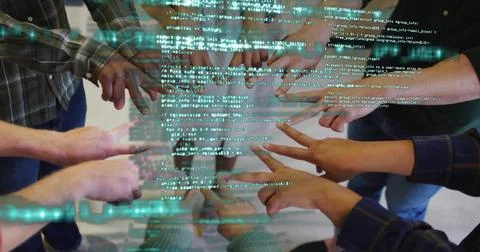 Pointing engineers' arms converging on floating code display in office area,  Stock Photos
