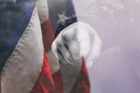 Pointing finger hand gesture the backdrop of the American flag. Concept with  Stock Photos