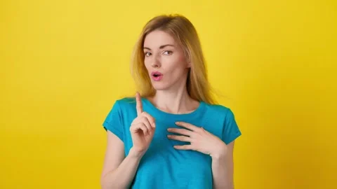 Pointing finger herself, say who me and | Stock Video | Pond5