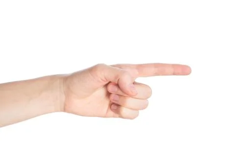 Pointing gesture. Female hand shows index finger on a white background isolat Stock Photos