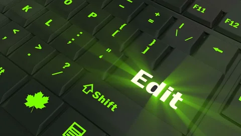 Pointing on green glowing Edit key Stock Footage 100561731