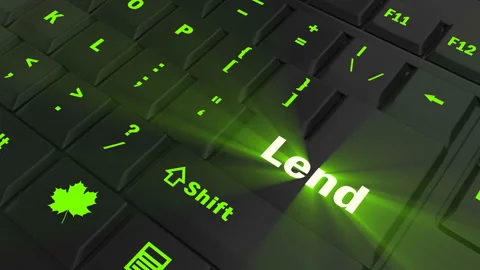 Pointing on green glowing Lend key Stock Footage 100636526