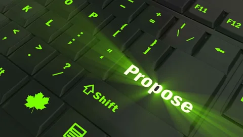Pointing on green glowing Propose key Stock Footage 100608725