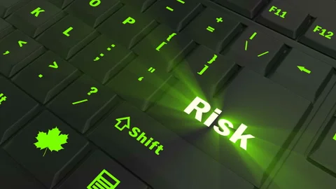 Pointing on green glowing Risk key Stock Footage 100637427