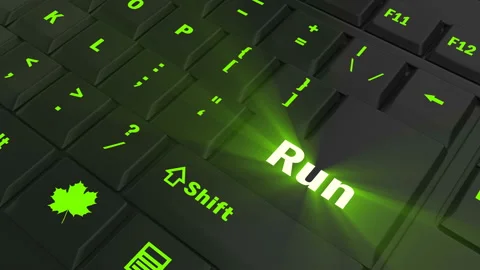 Pointing on green glowing Run key Stock Footage 100609004