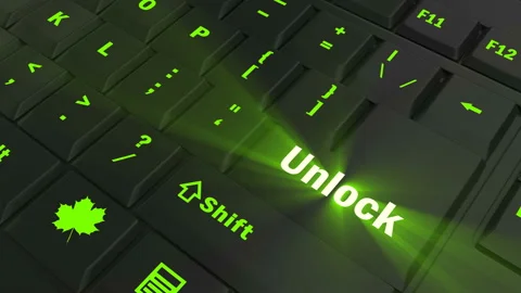 Pointing on green glowing Unlock key Stock Footage 100637550
