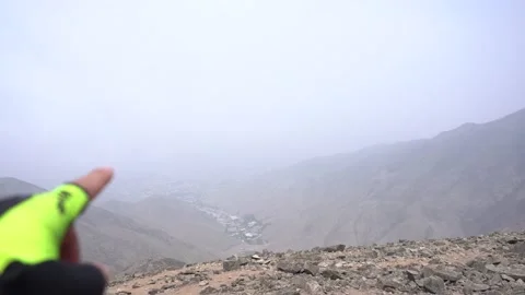 Pointing hand and finger out of focus in hiking and trekking 库存影片 145108471